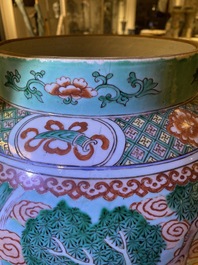 A pair of large Chinese turquoise-ground famille verte vases and covers, 19th C.